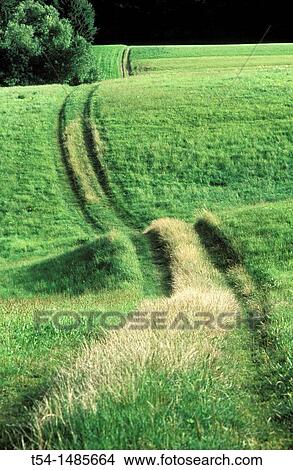 By hilly road leading View Large Photo Image Picture - By hilly road leading. Fotosearch