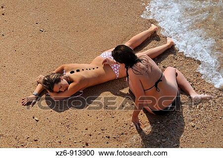by treatment with stones on the beach View Large Photo Image Stock Image - by treatment with stones on the beach. Fotosearch