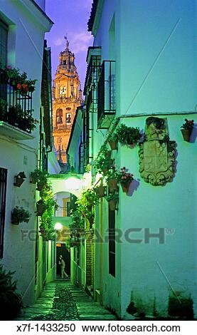 C? rdoba Andalusia Spain: Calleja de las Flores, in the background Bell tower or minaret of the mosque-cathedral View Large Photo Image Stock Image - C? rdoba Andalusia Spain: Calleja de las Flores, in the background Bell tower or minaret of the mosque-cathedral. Fotosearch