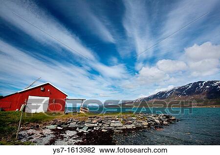 Cabin overlooking a fjord and snowy mountains in Lyngen Peninsula, Troms county, Norway, Europe View Large Photo Image Stock Image - Cabin overlooking a fjord and snowy mountains in Lyngen Peninsula, Troms county, Norway, Europe. Fotosearch