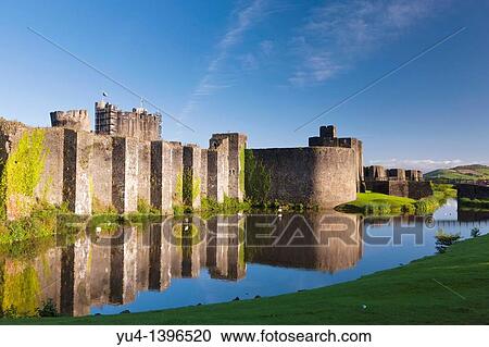 Caerphilly Castle Welsh: Castell Caerffili is a medieval castle that dominates the centre of the town of Caerphilly in south Wales It is the largest castle in Wales and the second largest in Britain after Windsor Castle View Large Photo Image Stock Image - Caerphilly Castle Welsh: Castell Caerffili is a medieval castle that dominates the centre of the town of Caerphilly in south Wales It is the largest castle in Wales and the second largest in Britain after Windsor Castle. Fotosearch