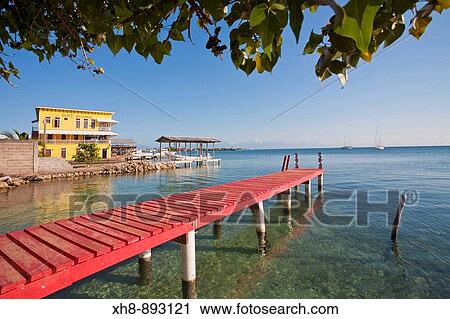 Cafe Mariposa and red jetty, Utila, Bay Islands, Honduras View Large Photo Image Stock Image - Cafe Mariposa and red jetty, Utila, Bay Islands, Honduras. Fotosearch