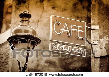 Stock Photography - Cafe sign and lamp post, Paris, France.. Fotosearch