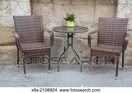 Cafe Table and Chair in Urban Setting. View Large Photo Image Picture - Cafe Table and Chair in Urban Setting.. Fotosearch