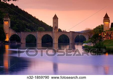 Cahors, Valentre bridge, Pont Valentre at Dusk, Lot River, Lot departament, Quercy, Via Podiensis, Way of St James, France View Large Photo Image Stock Image - Cahors, Valentre bridge, Pont Valentre at Dusk, Lot River, Lot departament, Quercy, Via Podiensis, Way of St James, France. Fotosearch