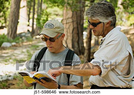 CALIFORNIA South Lake Tahoe Two middle aged men consult trail guide on Rubicon Trail View Large Photo Image Stock Photograph - CALIFORNIA South Lake Tahoe Two middle aged men consult trail guide on Rubicon Trail. Fotosearch