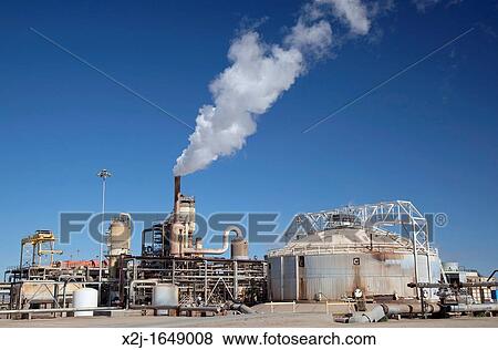 Stock Photo - Calipatria, California - A geothermal energy plant operated by CalEnergy in California's Imperial Valley The pipes carry hot water or steam from deep underground, which is used to generate electricity. Fotosearch