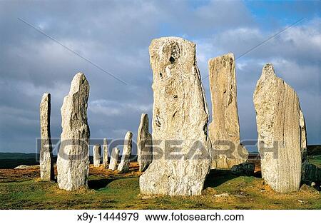 Callanish prehistoric stone circle is over 5000 years old Scottish Hebrides island of Lewis Central stones around burial cist View Large Photo Image Stock Photo - Callanish prehistoric stone circle is over 5000 years old Scottish Hebrides island of Lewis Central stones around burial cist. Fotosearch