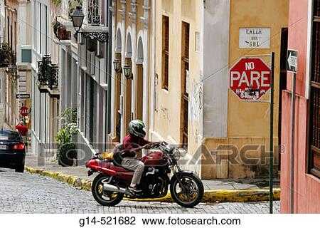 Calle del Sol, architecture, steep hill, motorcycle, adoquine cobblestone, stop sign. Old San Juan. Puerto Rico. View Large Photo Image Stock Image - Calle del Sol, architecture, steep hill, motorcycle, adoquine cobblestone, stop sign. Old San Juan. Puerto Rico.. Fotosearch