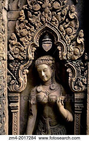 CAMBODIA, SIEM REAP, BANTEAY SREY TEMPLE, DETAIL OF TEMPLE, SANDSTONE CARVING, SMILING FIGURE. View Large Photo Image Picture - CAMBODIA, SIEM REAP, BANTEAY SREY TEMPLE, DETAIL OF TEMPLE, SANDSTONE CARVING, SMILING FIGURE.. Fotosearch