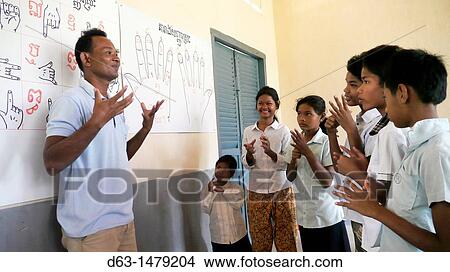 CAMBODIA. Village primary school Inclusive education: CRS works with local education authorities to include children with physical disabilities in regular classrooms View Large Photo Image Picture - CAMBODIA. Village primary school Inclusive education: CRS works with local education authorities to include children with physical disabilities in regular classrooms. Fotosearch