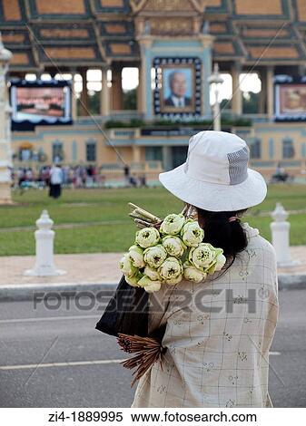 Cambodian woman selling lotus flowers in front of Royal Palace in Phnom Pen during the mourning of King Sihanouk death View Large Photo Image Stock Photography - Cambodian woman selling lotus flowers in front of Royal Palace in Phnom Pen during the mourning of King Sihanouk death. Fotosearch