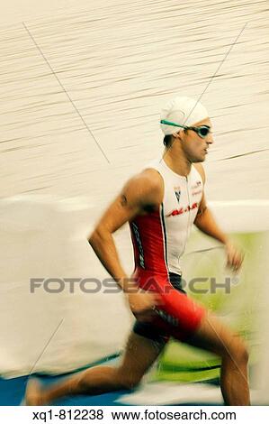 Campeonato de Triathlon. Prueba de NATACI? N. Madrid ITU World Cup. View Large Photo Image Stock Photo - Campeonato de Triathlon. Prueba de NATACI? N. Madrid ITU World Cup.. Fotosearch