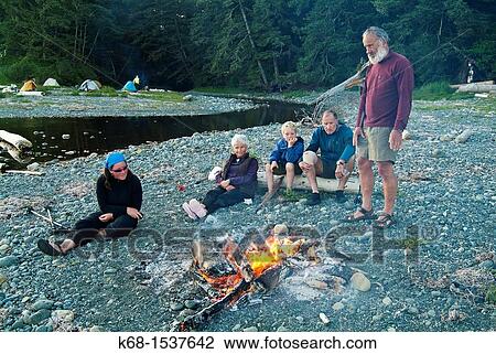 Stock Image - campers by a camp fire on Nootka Island, BC, Canada. Fotosearch