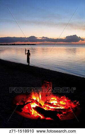Campfire on beach at sunset, Trou aux Biches, Mauritius View Large Photo Image Stock Image - Campfire on beach at sunset, Trou aux Biches, Mauritius. Fotosearch