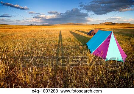 Stock Photo - Camping in the Gobi desert at sunset creating shadows lengthened. Fotosearch