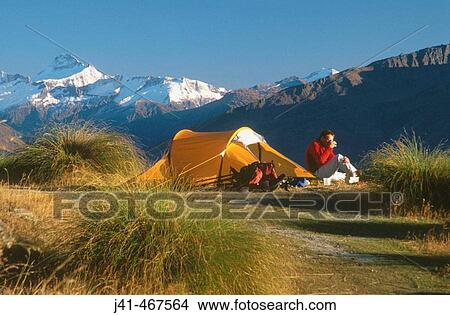 Campsite on Mt. Roy. Mt. Aspiring behind. Above lake Wanaka, central Otago. New Zealand. View Large Photo Image Picture - Campsite on Mt. Roy. Mt. Aspiring behind. Above lake Wanaka, central Otago. New Zealand.. Fotosearch