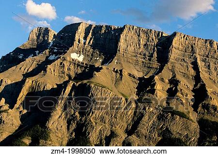 CANADA, ALBERTA, ROCKY MOUNTAINS, BANFF NATIONAL PARK, RUNDLE MOUNTAIN IN EVENING LIGHT. View Large Photo Image Stock Image - CANADA, ALBERTA, ROCKY MOUNTAINS, BANFF NATIONAL PARK, RUNDLE MOUNTAIN IN EVENING LIGHT.. Fotosearch