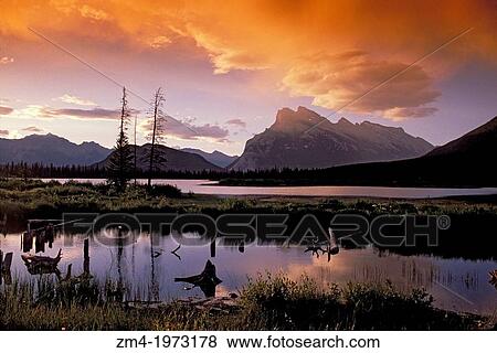 Stock Photo - CANADA, ALBERTA, ROCKY MOUNTAINS, BANFF NATIONAL PARK, SUNRISE AT VERMILION LAKES.. Fotosearch