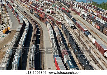 Stock Photograph - Canada, BC, Surrey CN Rail yard beneath the Port Mann Bridge. Fotosearch