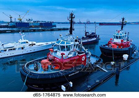 Stock Photography - Canada, British Columbia, North Vancouver, Port of Vancouver, tugboats, dusk. Fotosearch