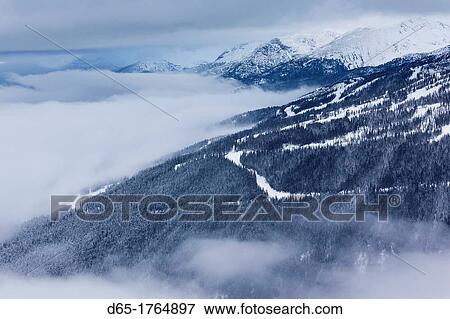 Stock Photo - Canada, British Columbia, Whistler, Peak 2 Peak Gondola between Whistler and Blackcomb Mountains, winter. Fotosearch