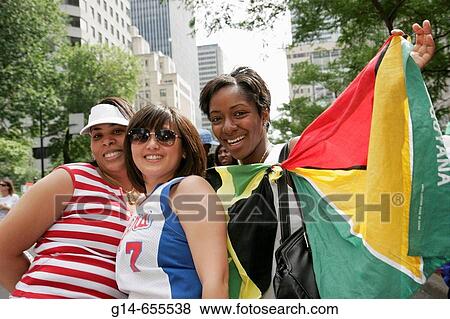 Stock Photo - Canada, Montreal, Boulevard Rene Levesque, Mardi Gras style parade, costume, Black female, Guyana flag, celebration,. Fotosearch