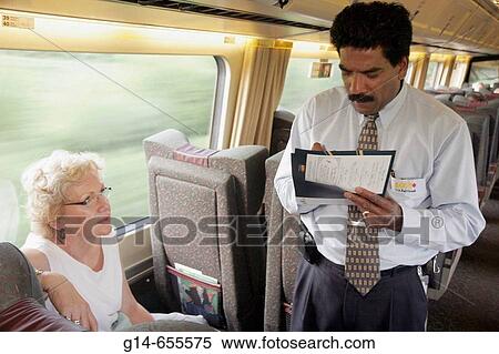 Canada, Montreal, VIA Rail, passenger train to Quebec City, Asian male porter, takes menu order, female, service, View Large Photo Image Stock Photography - Canada, Montreal, VIA Rail, passenger train to Quebec City, Asian male porter, takes menu order, female, service,. Fotosearch