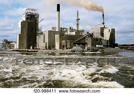 Stock Image - Canada, Newfoundland, river, paper mill. Fotosearch