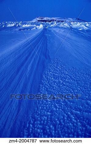 Stock Photo - CANADA, NUNAVUT, FROZEN BARROW STRAIT, NWT, WITH BEECHY ISLAND BACKGROUND.. Fotosearch