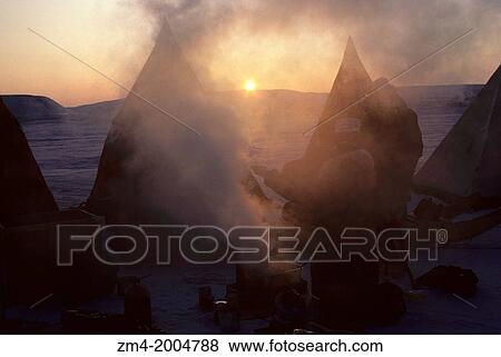 CANADA, NUNAVUT, FROZEN BARROW STRAIT, ICE CAMP AT SUNRISE, STEAM RISING FROM BREAKFAST COOKSTOVE. View Large Photo Image Stock Photo - CANADA, NUNAVUT, FROZEN BARROW STRAIT, ICE CAMP AT SUNRISE, STEAM RISING FROM BREAKFAST COOKSTOVE.. Fotosearch