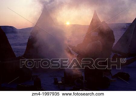 CANADA, NUNAVUT, FROZEN BARROW STRAIT, ICE CAMP AT SUNRISE, STEAM RISING FROM BREAKFAST COOKSTOVE. View Large Photo Image Stock Photography - CANADA, NUNAVUT, FROZEN BARROW STRAIT, ICE CAMP AT SUNRISE, STEAM RISING FROM BREAKFAST COOKSTOVE.. Fotosearch