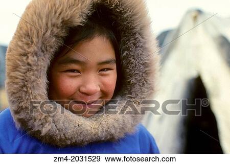 Stock Photo - CANADA, NUNAVUT, HUDSON BAY, BAFFIN ISLAND, CAPE DORSET, PORTRAIT OF INUIT GIRL.. Fotosearch