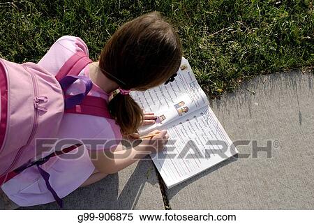 Canada, Ontario, Windsor. An eight year old girl with a pink knapsack writes in a notebook on a sidewalk. View Large Photo Image Stock Photography - Canada, Ontario, Windsor. An eight year old girl with a pink knapsack writes in a notebook on a sidewalk.. Fotosearch