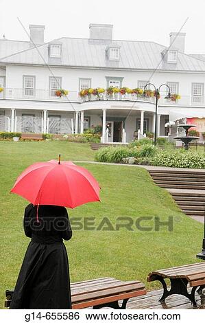 Canada, Quebec City, Parc de la Chute_Montmoracy, Manoir Montmoracy, waterfall park, woman, red umbrella, villa manor, View Large Photo Image Stock Photograph - Canada, Quebec City, Parc de la Chute_Montmoracy, Manoir Montmoracy, waterfall park, woman, red umbrella, villa manor,. Fotosearch