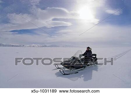 Canadian High Arctic, Lancaster Sound, Nunavut Canada May 2004 Driving snowmobile on sea ice View Large Photo Image Stock Photo - Canadian High Arctic, Lancaster Sound, Nunavut Canada May 2004 Driving snowmobile on sea ice. Fotosearch