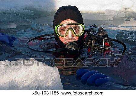 Canadian High Arctic, Lancaster Sound, Nunavut Canada May 2004 Martin Almqvist preparing to ice dive in a sea ice crack View Large Photo Image Stock Photography - Canadian High Arctic, Lancaster Sound, Nunavut Canada May 2004 Martin Almqvist preparing to ice dive in a sea ice crack. Fotosearch