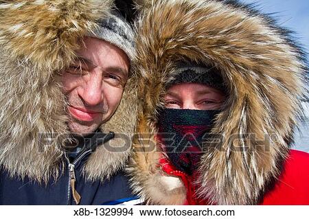 Canadian photographer Gilles Pucheu and his wife Marianne in Arctic clothingk near their home in Yellowknife, Northwest Territories, Canada View Large Photo Image Picture - Canadian photographer Gilles Pucheu and his wife Marianne in Arctic clothingk near their home in Yellowknife, Northwest Territories, Canada. Fotosearch
