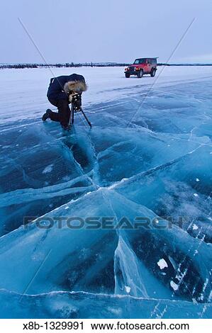 Stock Image - Canadian photographer Gilles Pucheu at work near his home in Yellowknife, Northwest Territories, Canada. Fotosearch