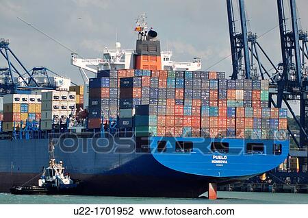 Stock Image - Canal de PanamB Panama: cargo ship along the Canal. Fotosearch