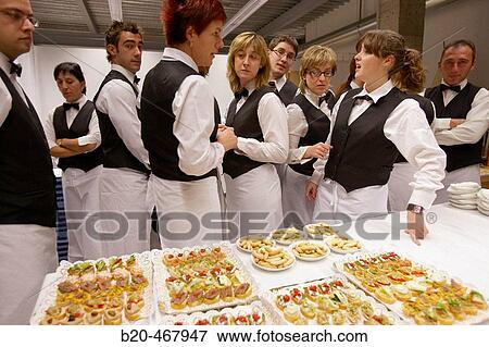 Stock Photo - Canapes and waiters. Catering. Opening of Juantxo Mugica Decoraci? n exhibition. Oyartzun, Gipuzkoa. Euskadi. Spain.. Fotosearch