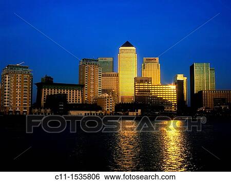 canary wharf isle of dogs from across river thames dusk sunset london england uk View Large Photo Image Stock Photograph - canary wharf isle of dogs from across river thames dusk sunset london england uk. Fotosearch