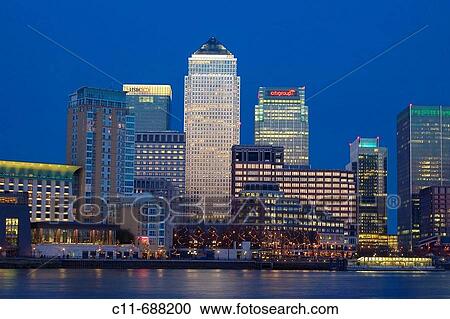 canary wharf shot from across the river thames night evening illuminated office blocks london england uk europe View Large Photo Image Stock Image - canary wharf shot from across the river thames night evening illuminated office blocks london england uk europe. Fotosearch