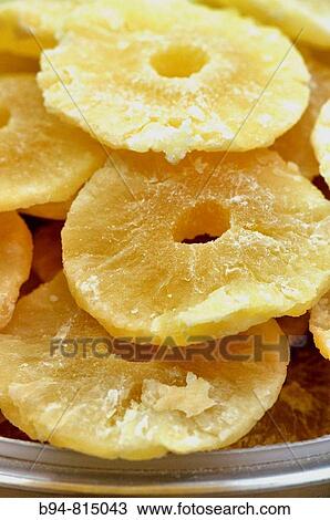 Stock Image - Candied pineapple at La Boqueria market, Barcelona. Catalonia, Spain. Fotosearch