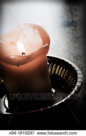 Candle as an offering religious and Christian worship View Large Photo Image Stock Photo - Candle as an offering religious and Christian worship. Fotosearch