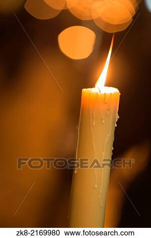 Candle light with light bokeh in the background. View Large Photo Image Stock Image - Candle light with light bokeh in the background.. Fotosearch