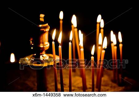 Candles in a church Parikia village, Paros island, Cyclades islands, Aegean Sea, Greece, Europe View Large Photo Image Stock Photo - Candles in a church Parikia village, Paros island, Cyclades islands, Aegean Sea, Greece, Europe. Fotosearch