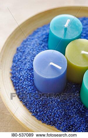 Candles in blue sand View Large Photo Image Stock Photo - Candles in blue sand. Fotosearch