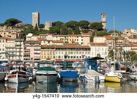 Stock Image - Cannes, harbour, old quarter in background, French Riviera. Fotosearch