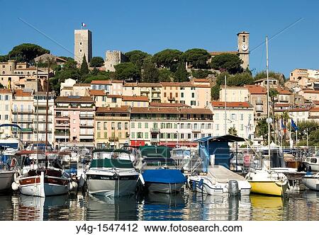 Stock Image - Cannes, harbour, old quarter in background, French Riviera. Fotosearch